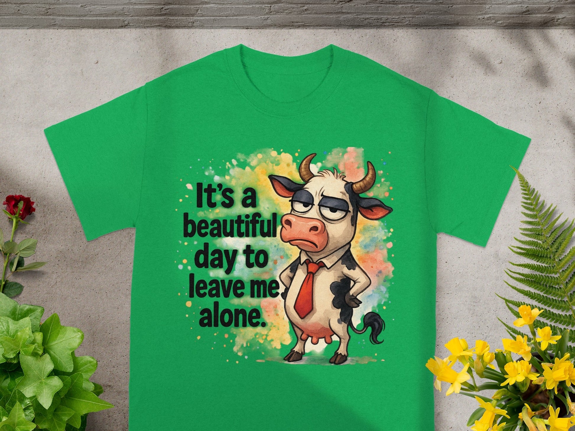 Green t-shirt with a cartoon cow saying "It's a beautiful day to leave me alone."