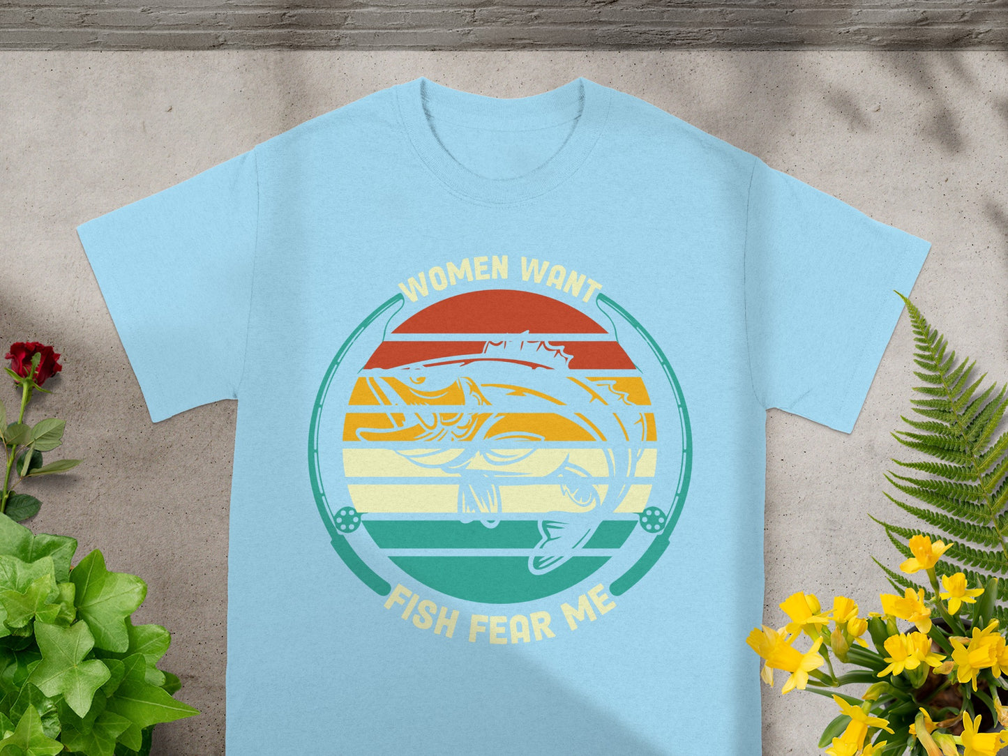 Light blue t-shirt with circle design featuring fish, stripes, fishing rods, and text.