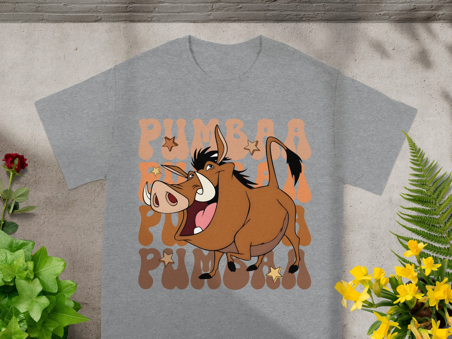 Grey t-shirt with cartoon Pumbaa from The Lion King and text.