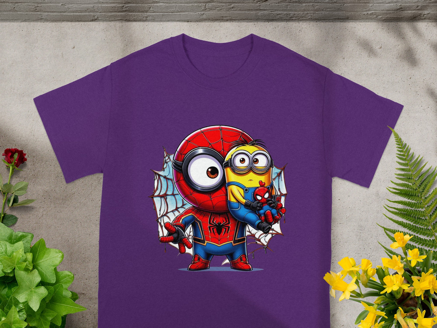 Purple t-shirt featuring a Minion dressed as Spider-Man holding a smaller Spider-Man toy.