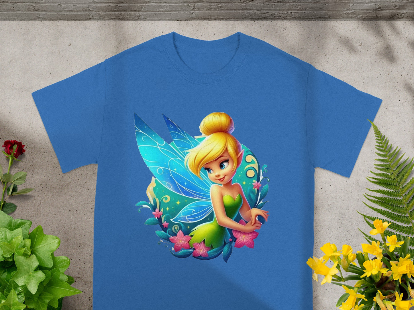Blue t-shirt featuring Tinkerbell with blue wings and pink flowers.