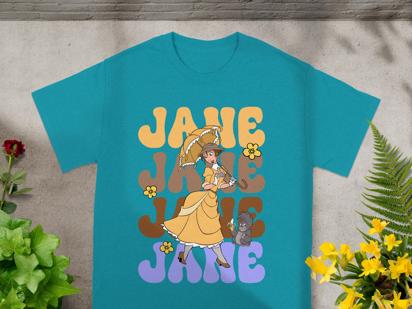Blue t-shirt with yellow "JANE" text, a woman, and a monkey.