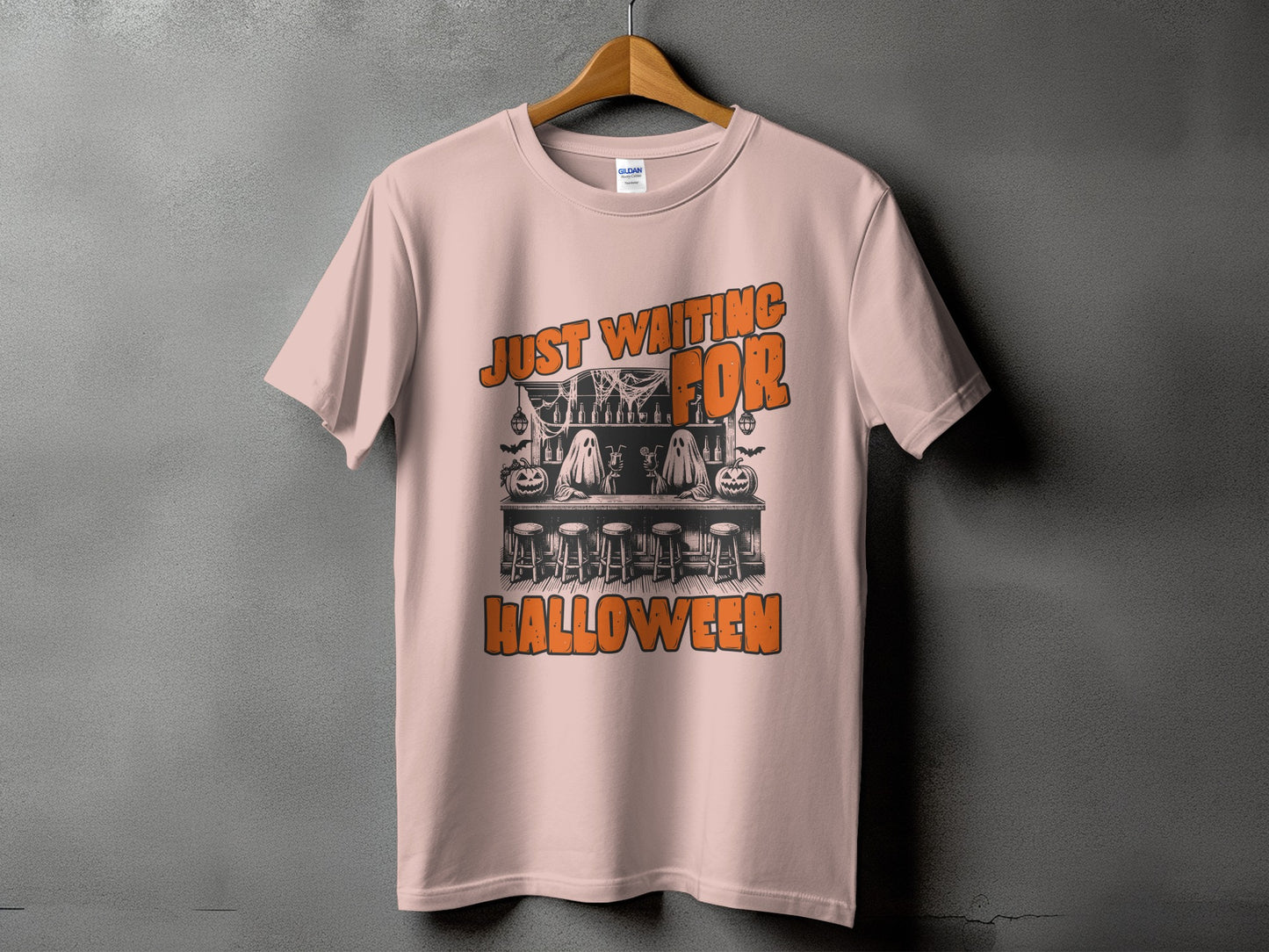 Pink t-shirt with "JUST WAITING FOR HALLOWEEN" text and spooky bar graphic.