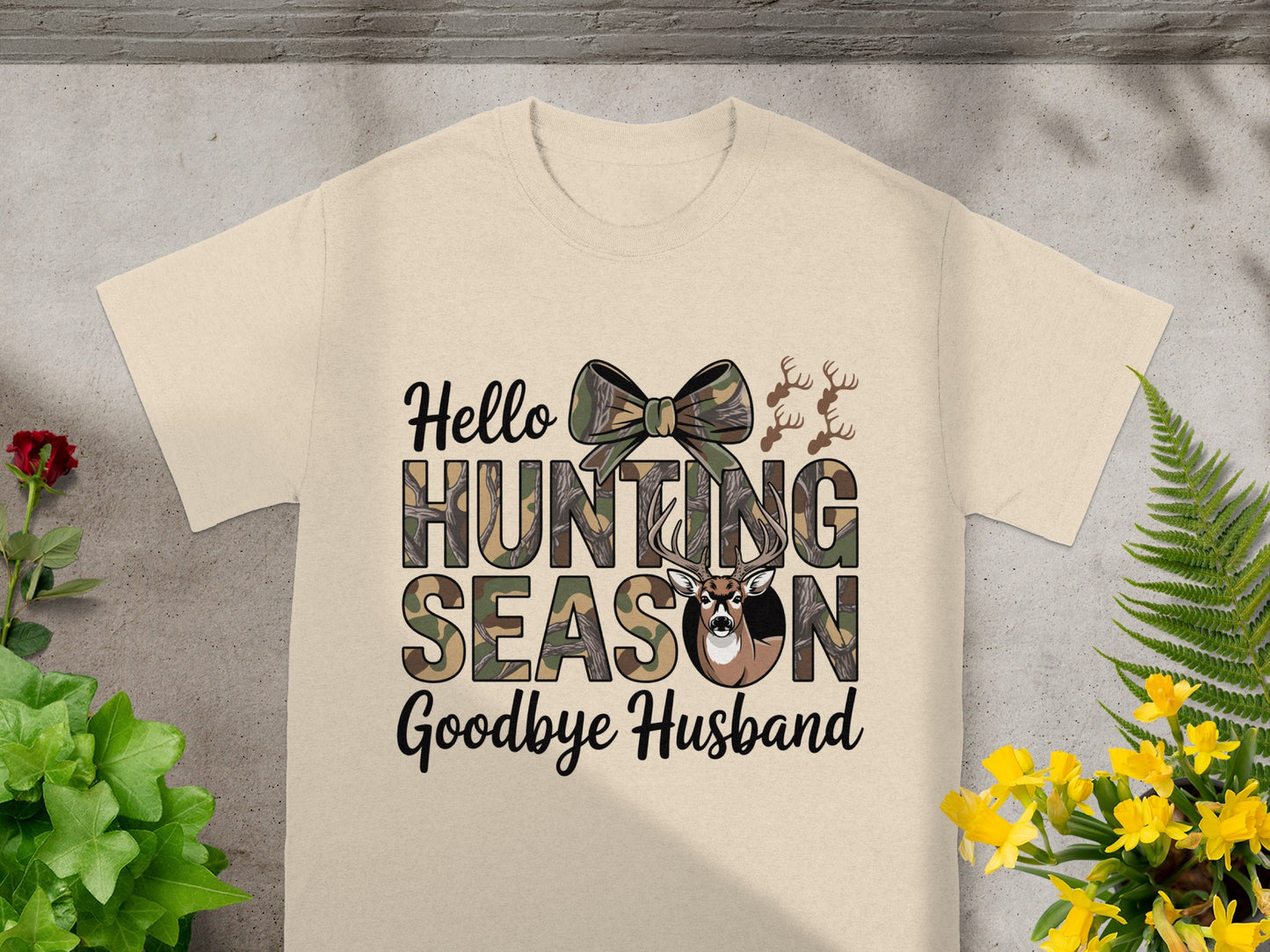 Cream t-shirt with "Hello Hunting Season Goodbye Husband" text, camouflage, and deer design.