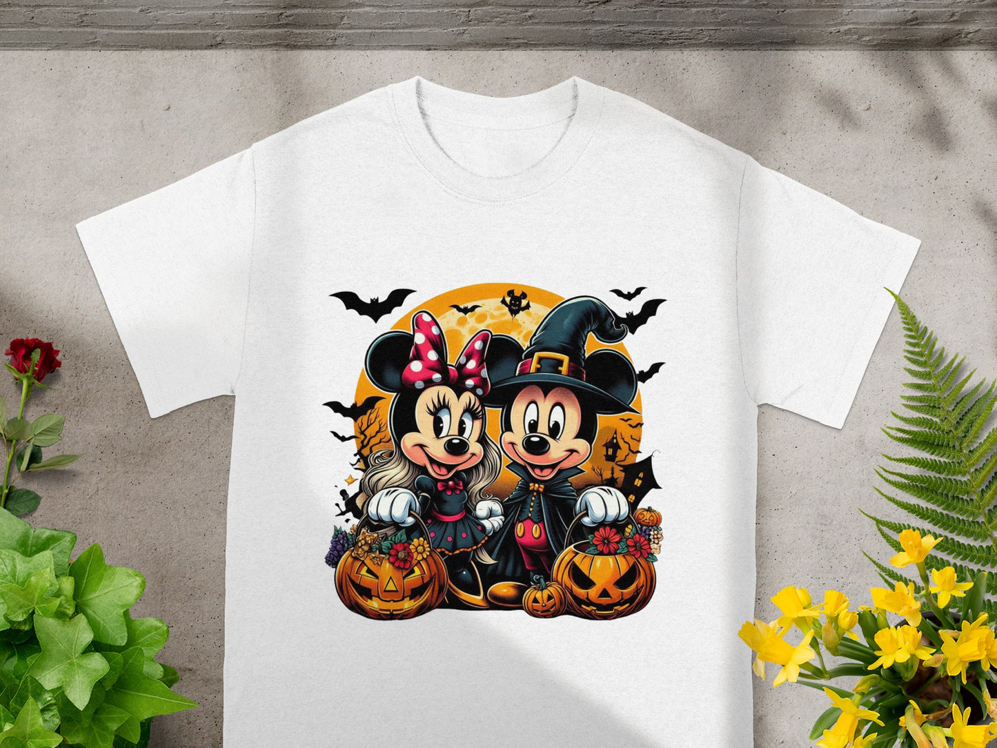 Minnie and Mickey Mouse in Halloween costumes with pumpkins and bats.