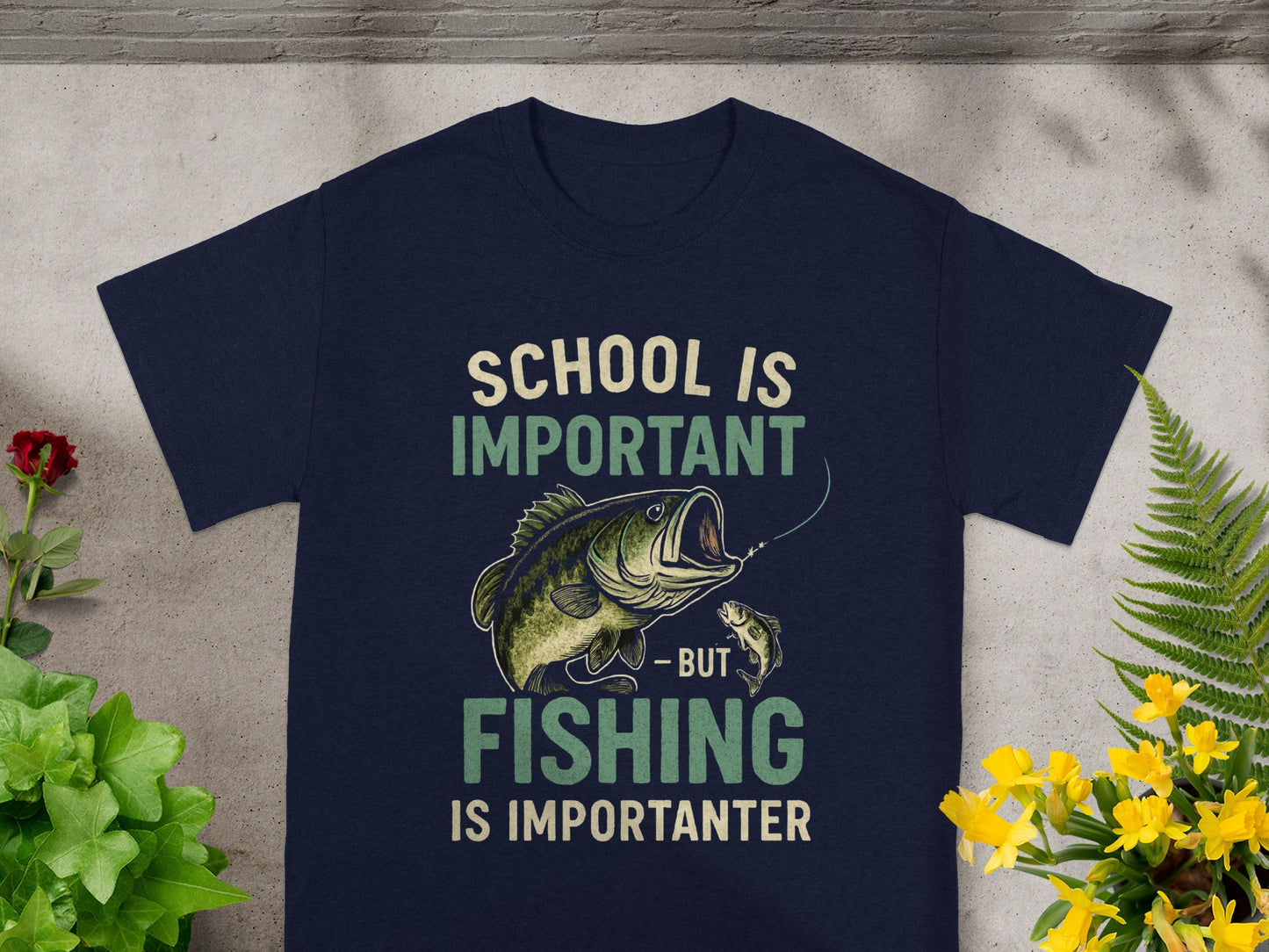 Dark blue t-shirt with text "School is important - but fishing is importanter" and fish graphics.
