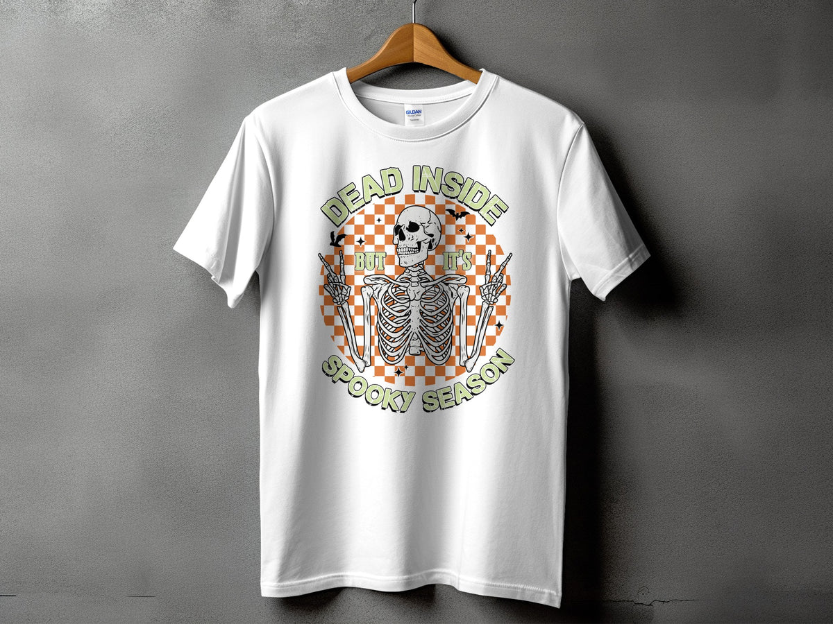 White t-shirt with skeleton graphic and text "Dead Inside But It's Spooky Season".