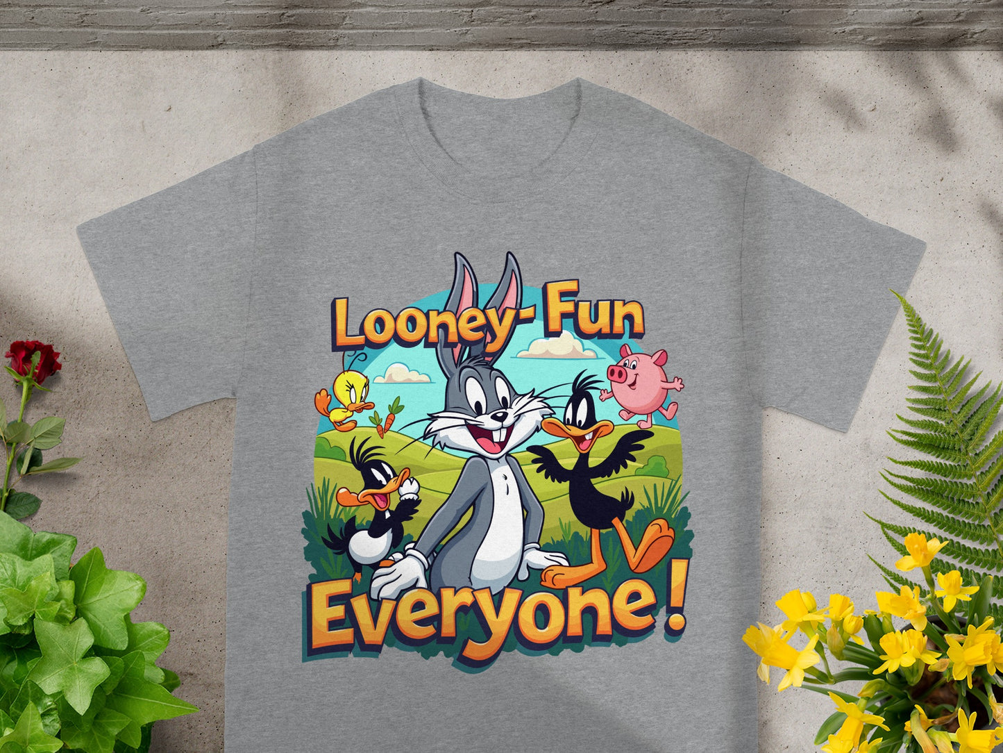 Looney Fun Everyone! graphic on a gray t-shirt with cartoon characters.