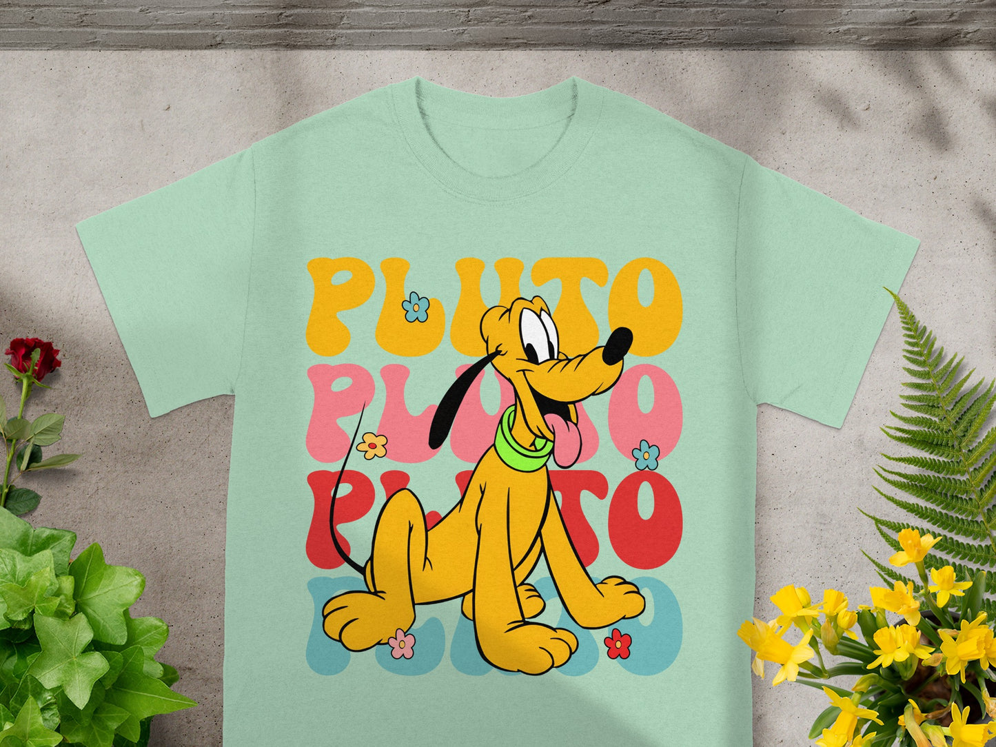 Mint t-shirt with colorful "PLUTO" text and a smiling Pluto cartoon dog.