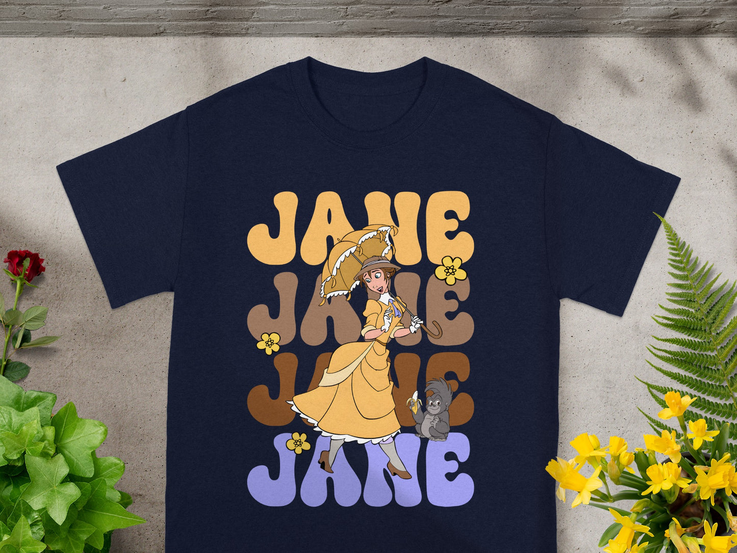 Navy t-shirt with "Jane" repeated in retro font, featuring a woman with umbrella.