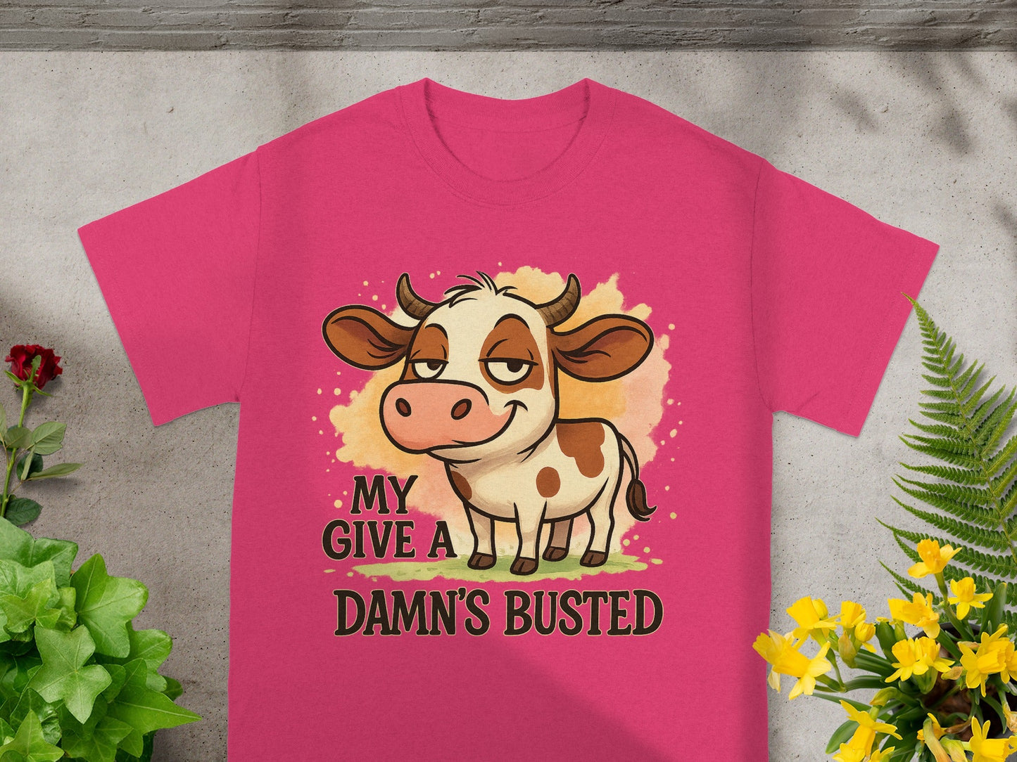 Pink t-shirt with cartoon cow and "MY D--- BUSTED" text.