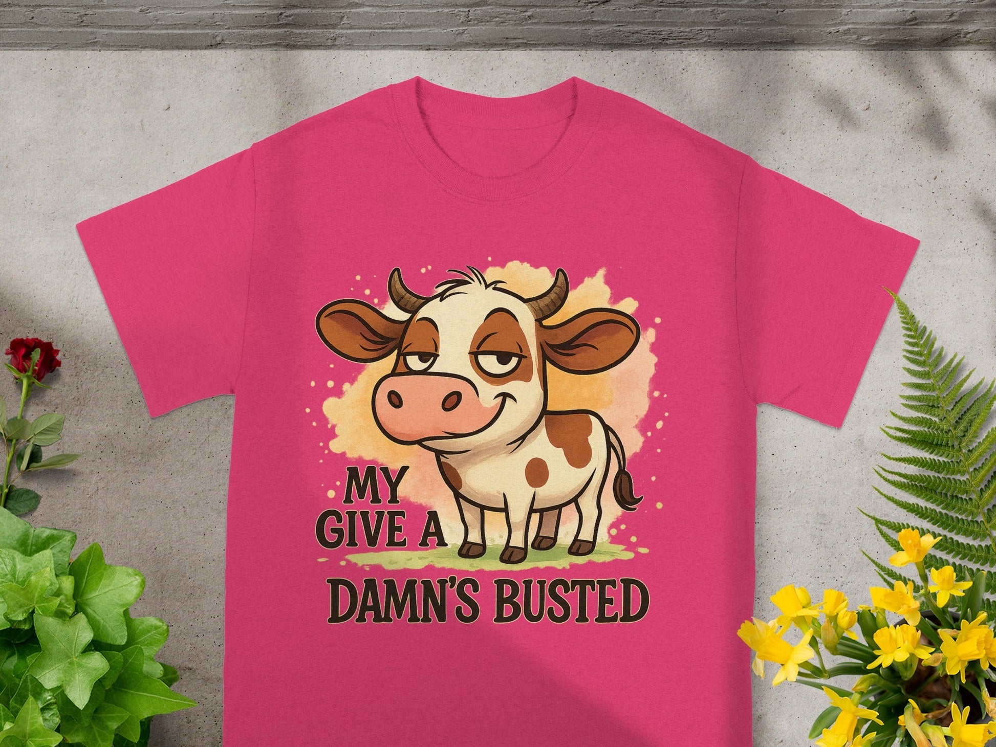 Pink t-shirt with cartoon cow and "MY D--- BUSTED" text.