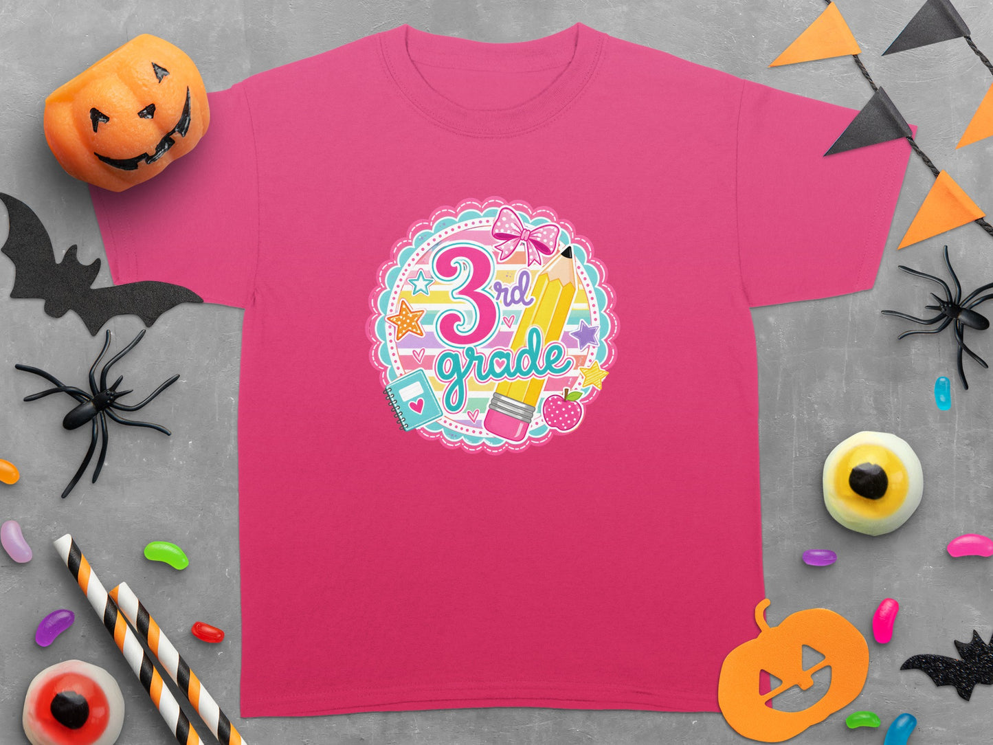 Pink t-shirt for 3rd Grade with pencil, apple, and school supplies graphic.