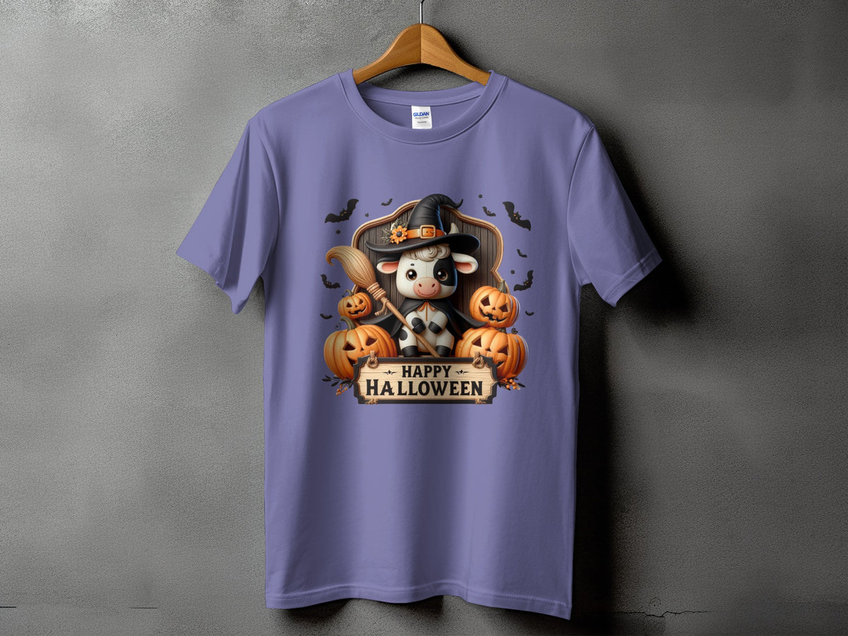 Purple t-shirt with a cow wearing a witch hat and holding a broom with pumpkins.