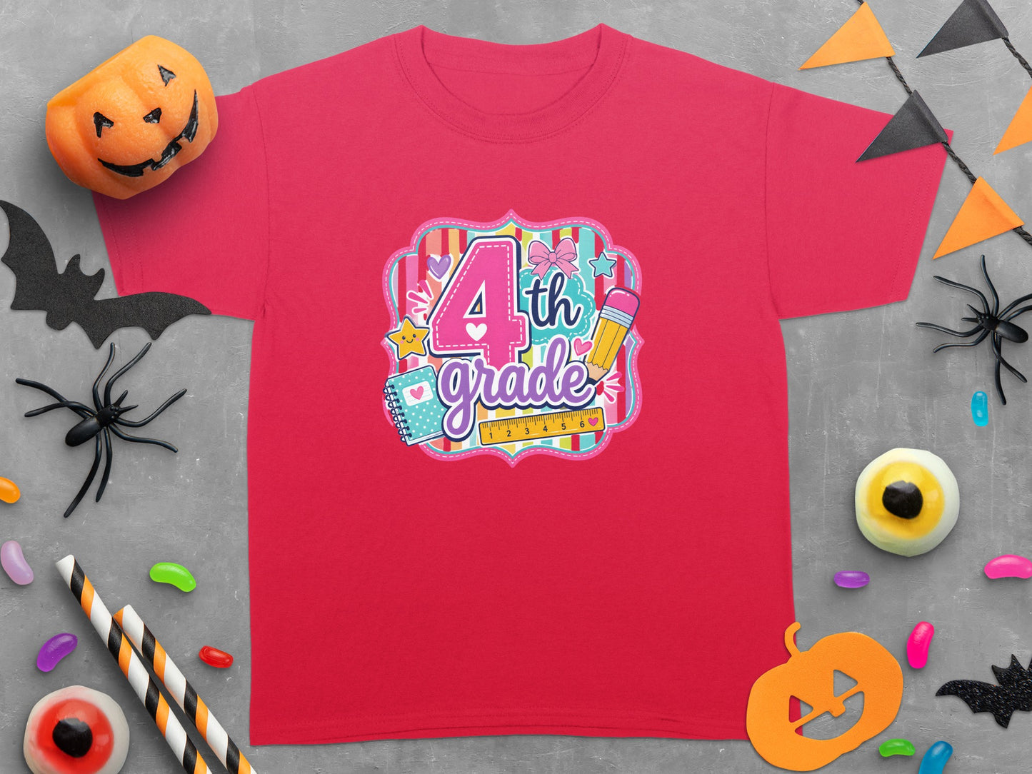 Red t-shirt with "4th grade" design featuring school supplies and Halloween decorations.