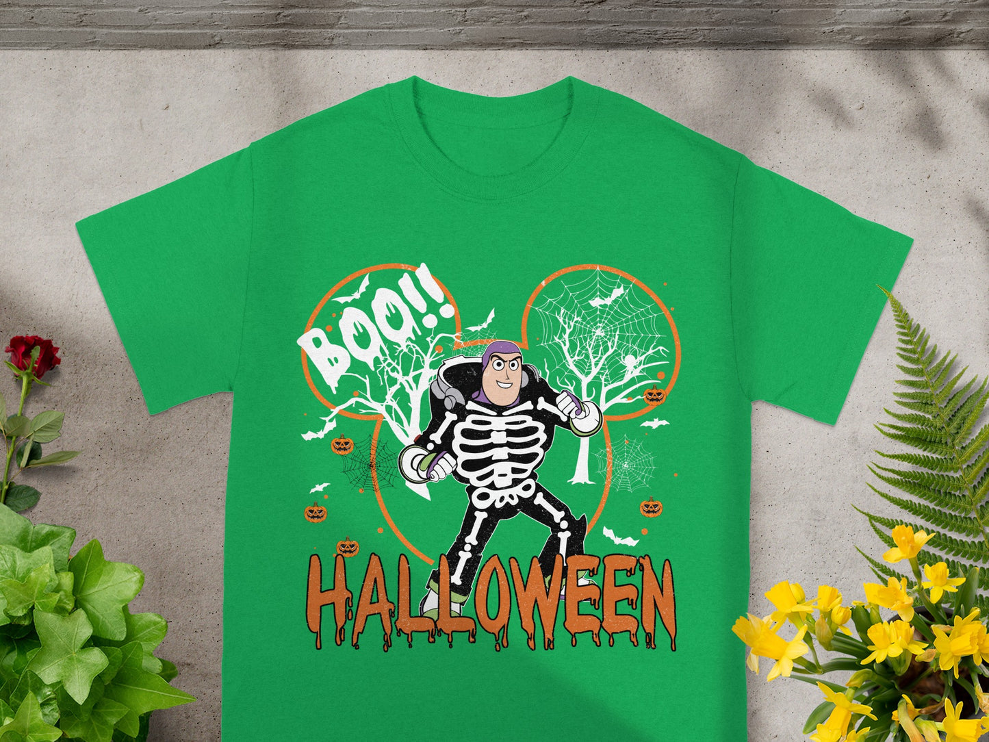 Buzz Lightyear skeleton costume on green t-shirt with "BOO!!" and "HALLOWEEN" text.