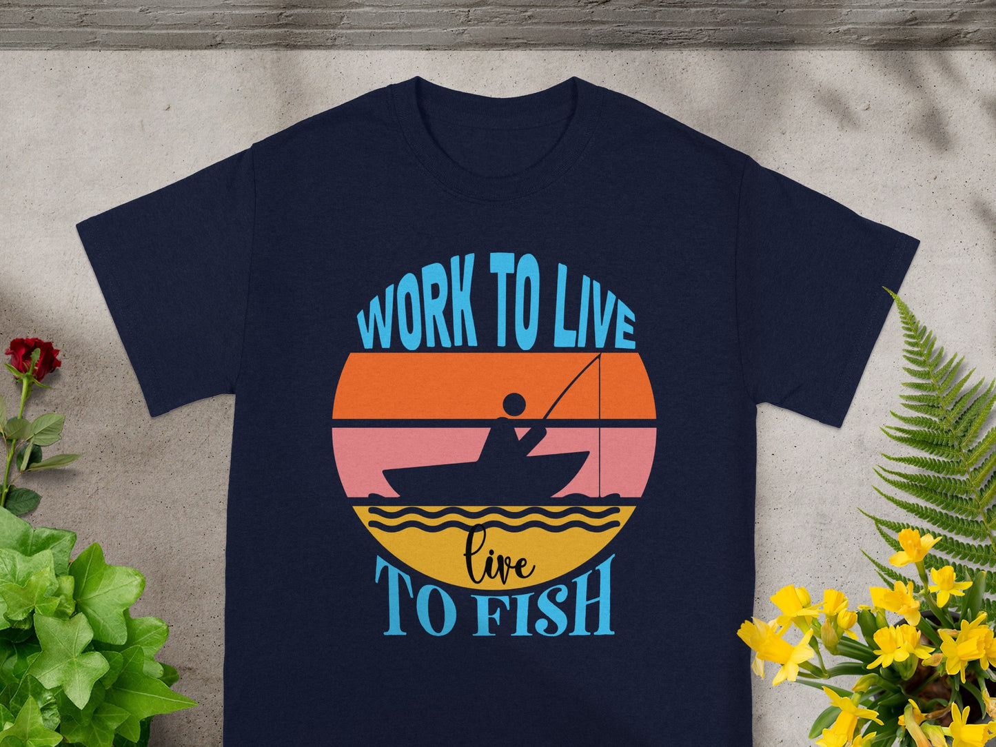 Navy t-shirt with "Work to Live Live To Fish" fishing graphic.