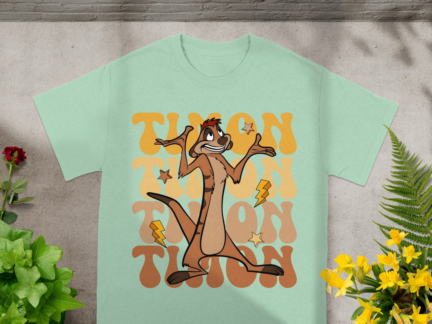 Mint t-shirt with Timon from The Lion King graphic and "Timon" text.
