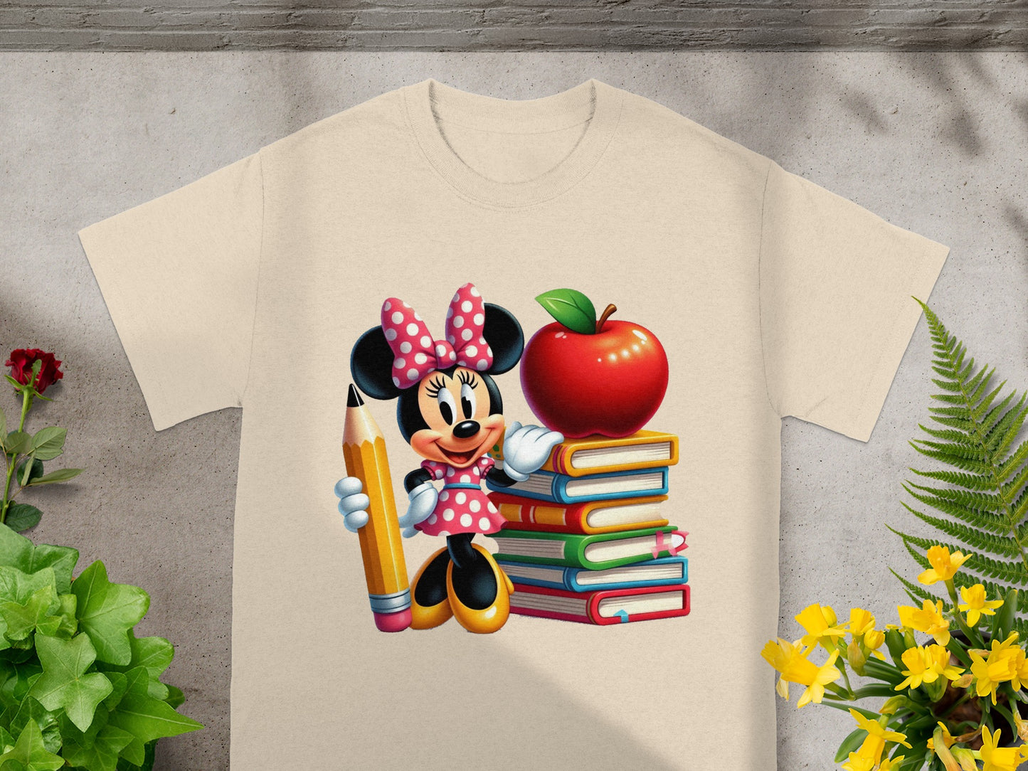 Minnie Mouse in a polka dot dress holding a pencil and standing beside a stack of books.