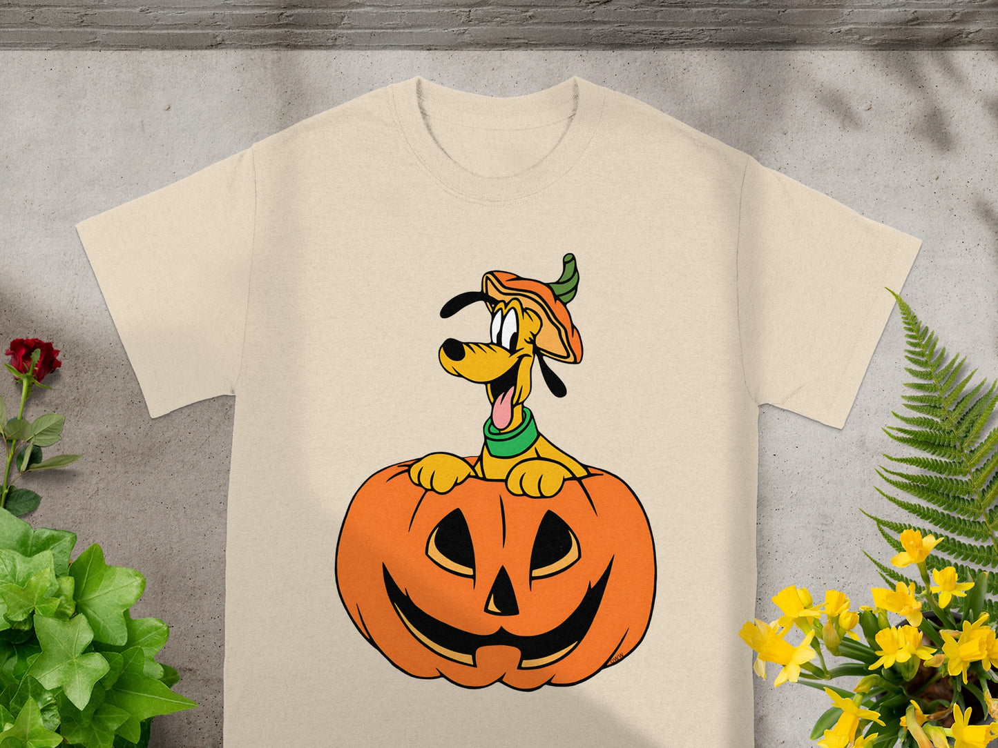 T-shirt with cartoon dog Pluto inside a jack-o'-lantern wearing a pumpkin hat.