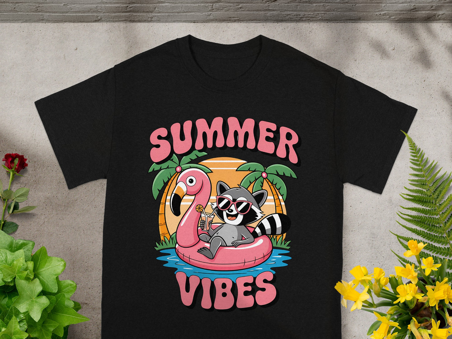 Black t-shirt with "SUMMER VIBES" text and raccoon on flamingo float