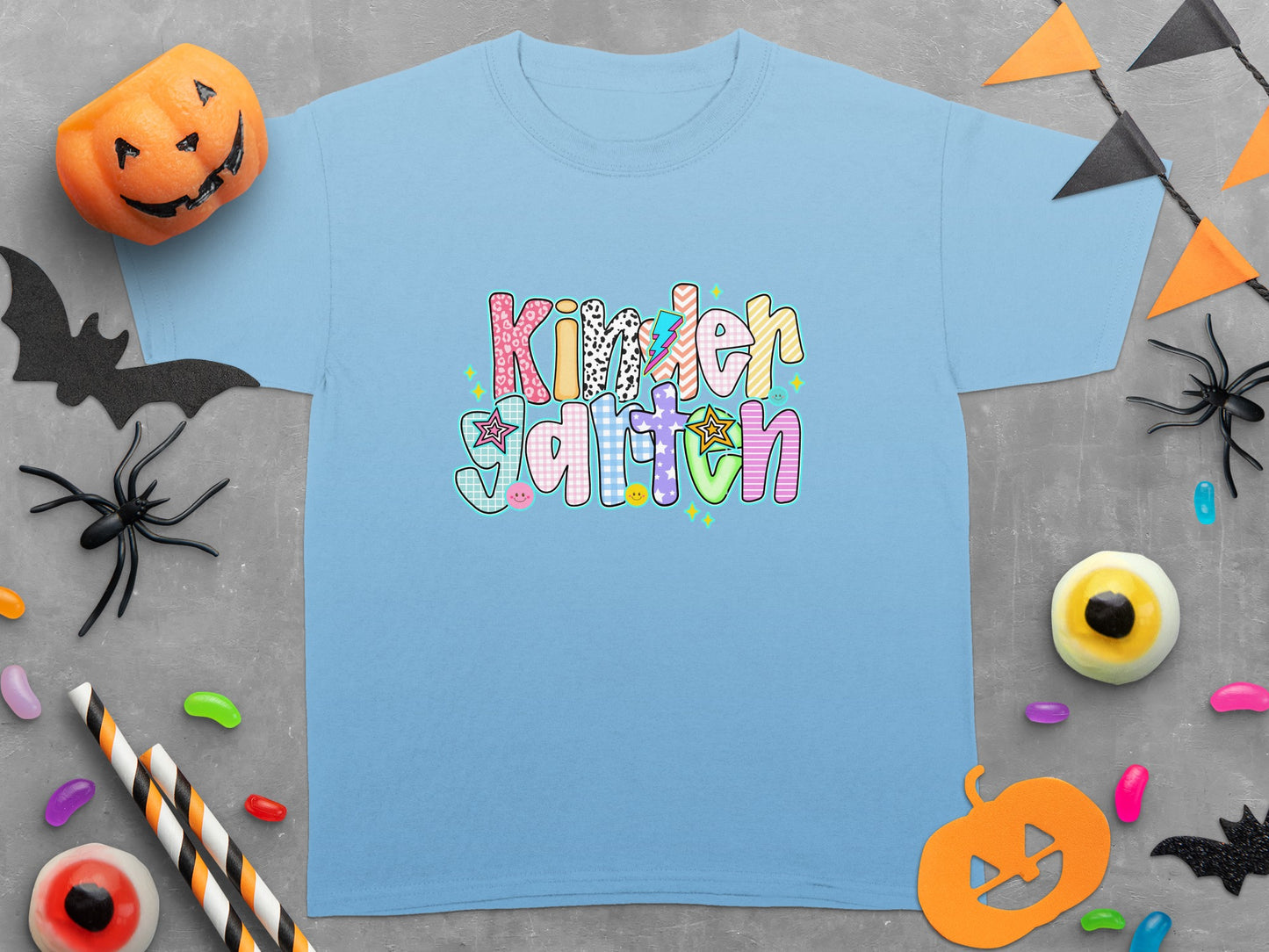 Light blue t-shirt with "Kindergarten" in colorful, patterned block letters.