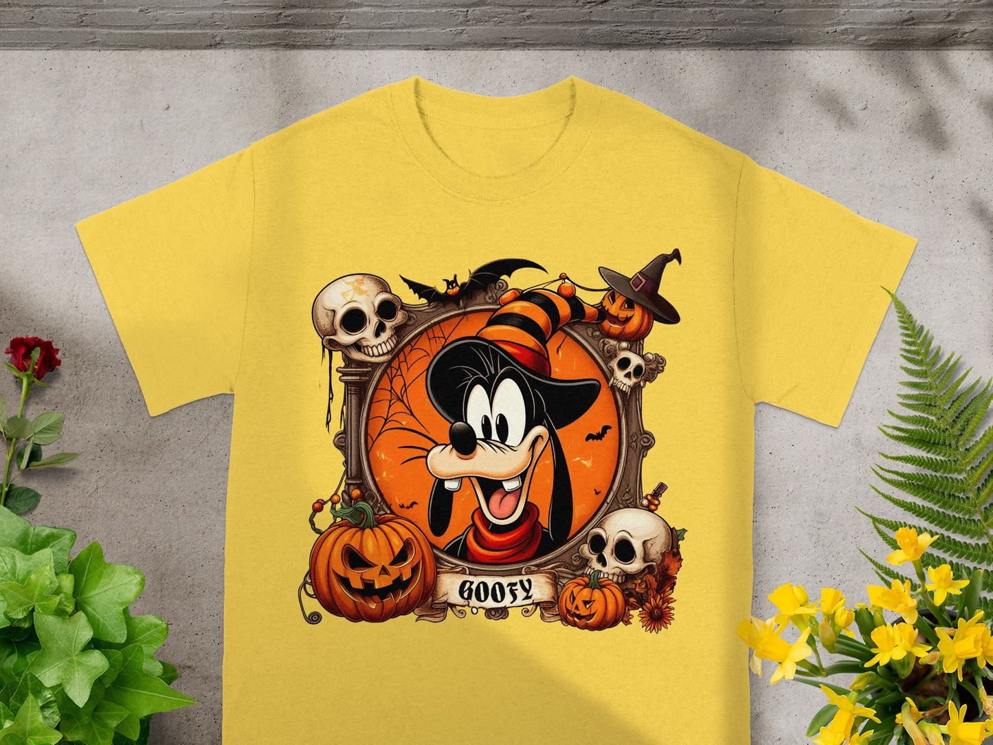 Goofy in a Halloween frame with pumpkins, skulls, and bats, text reads "Goofy."