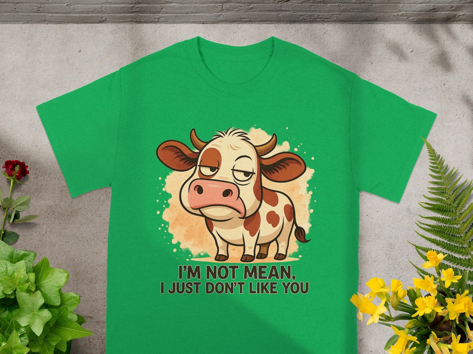 Green t-shirt with cartoon cow saying "I'm not mean, I just don't like you."