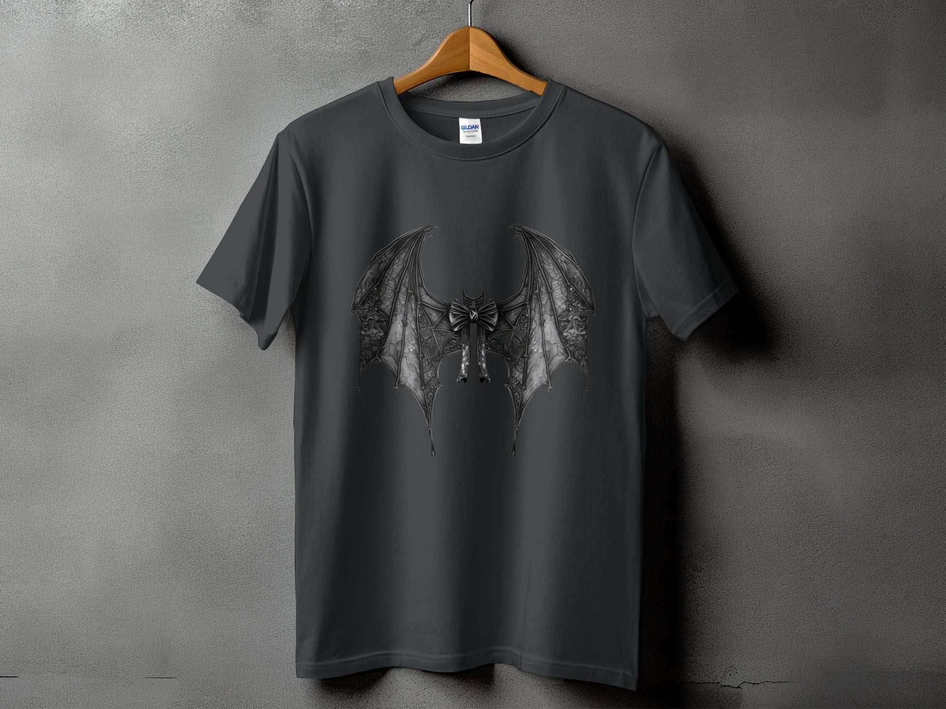 Dark grey t-shirt with gothic bat wing design and bow detail.