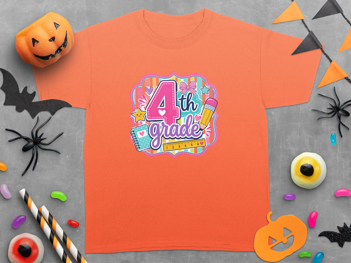 Orange T-shirt with "4th grade" design featuring school supplies and Halloween decorations.