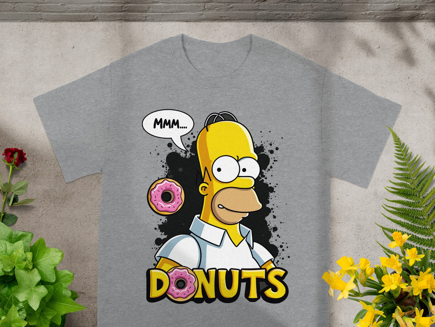 Grey t-shirt with Homer Simpson saying "MMM.... DONUTS" next to two pink donuts.