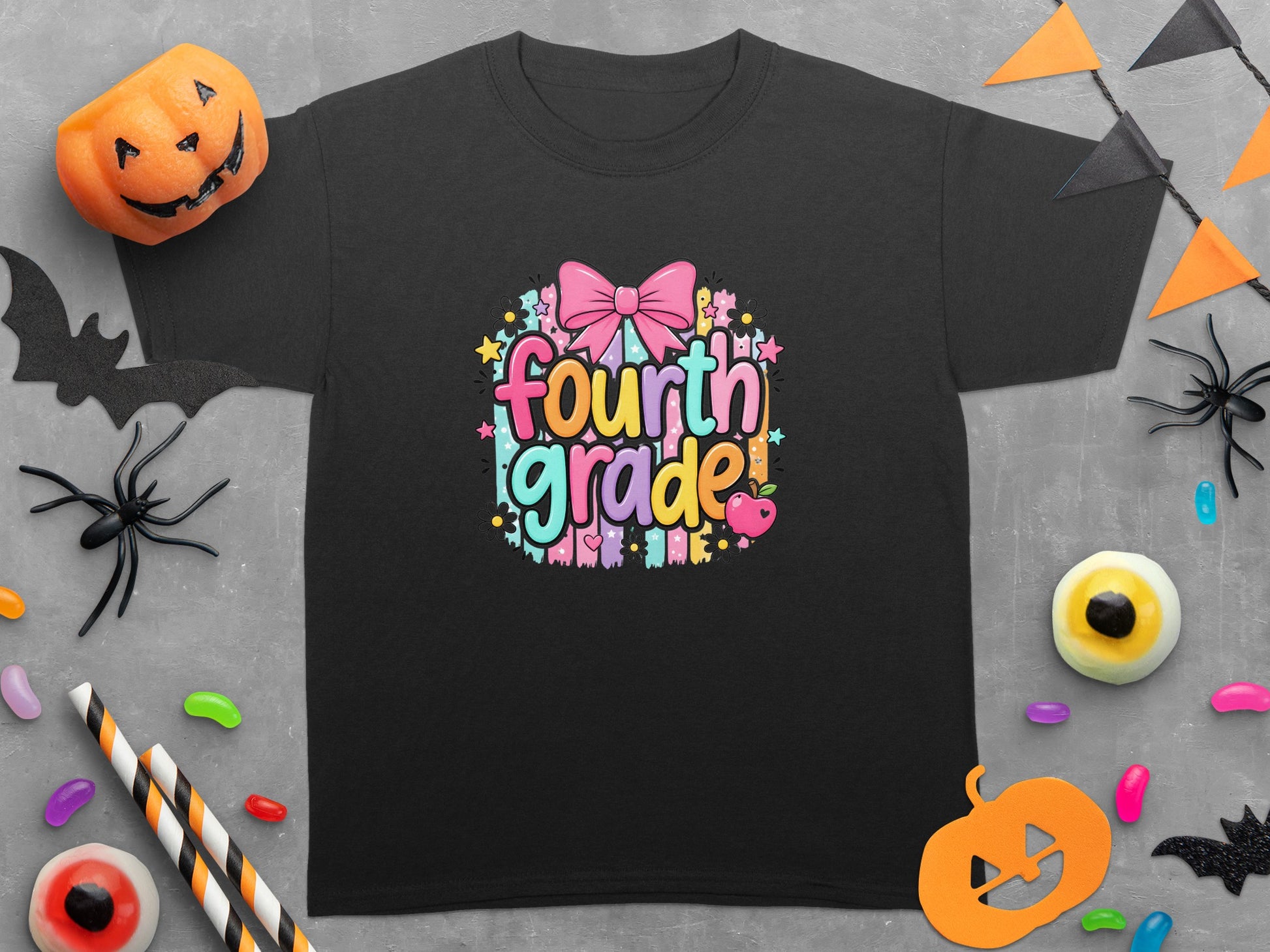 Black t-shirt with "fourth grade" in colorful bubbly font with a pink bow.