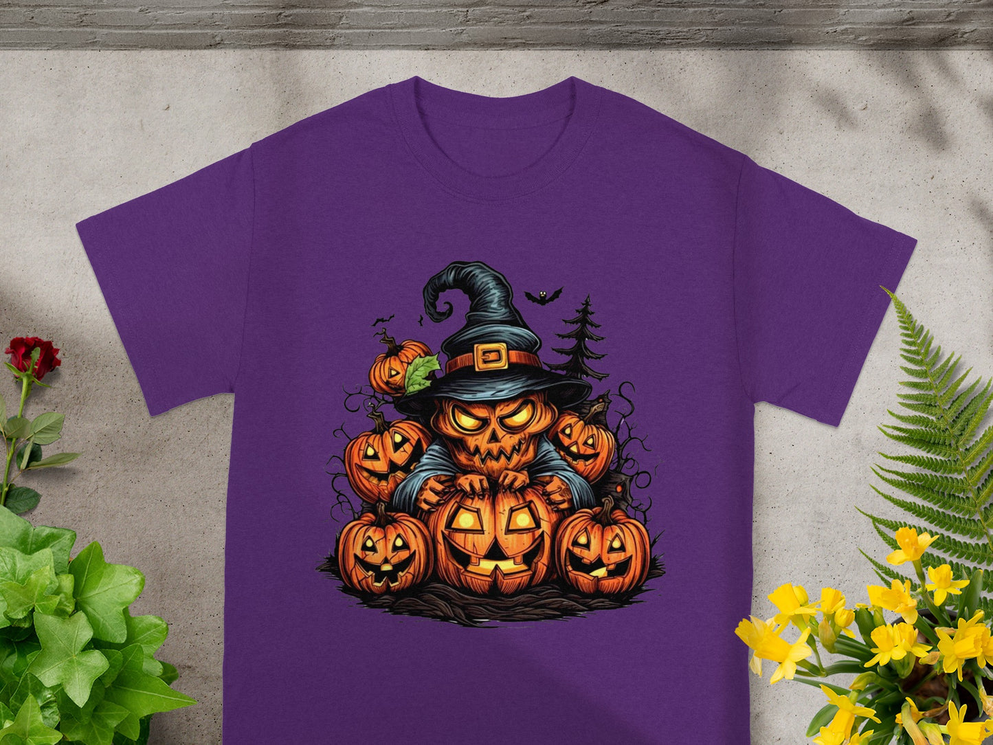 Purple t-shirt with a jack-o'-lantern character surrounded by pumpkins.