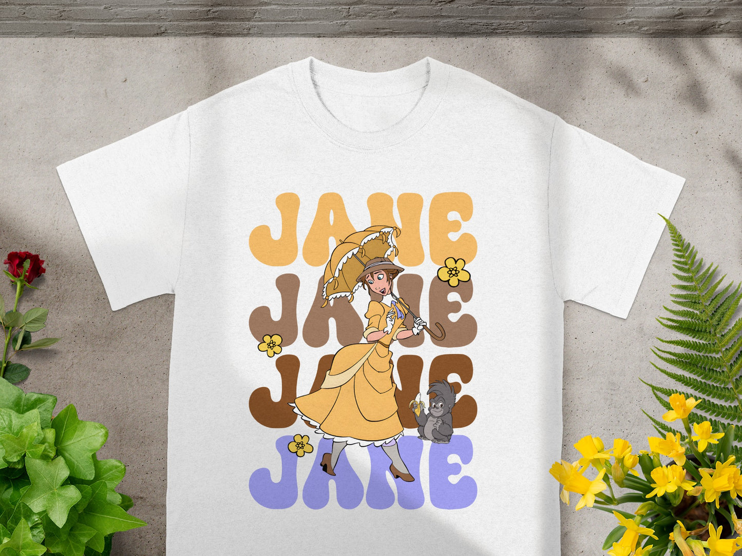 T-shirt with "Jane" text and cartoon of Jane and a gorilla under an umbrella.
