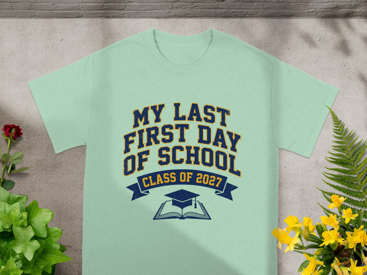 Light blue t-shirt with "My Last First Day of School Class of 2027" text.