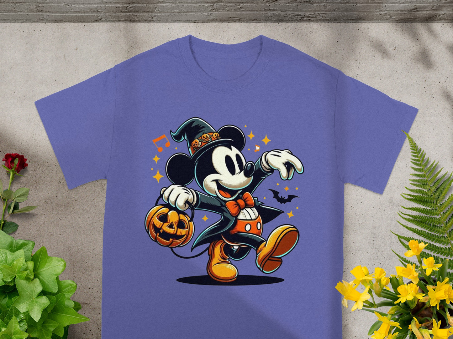 Mickey Mouse in Halloween costume carrying pumpkin bucket, with bat and stars.