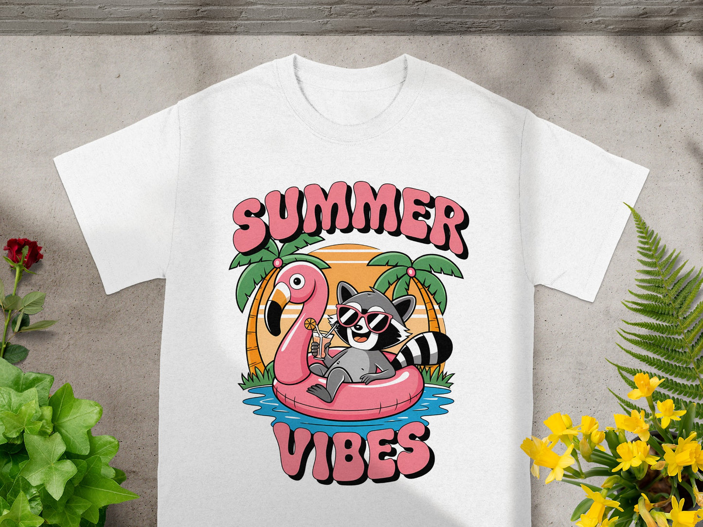 White t-shirt with "SUMMER VIBES" text and a raccoon on a flamingo float.