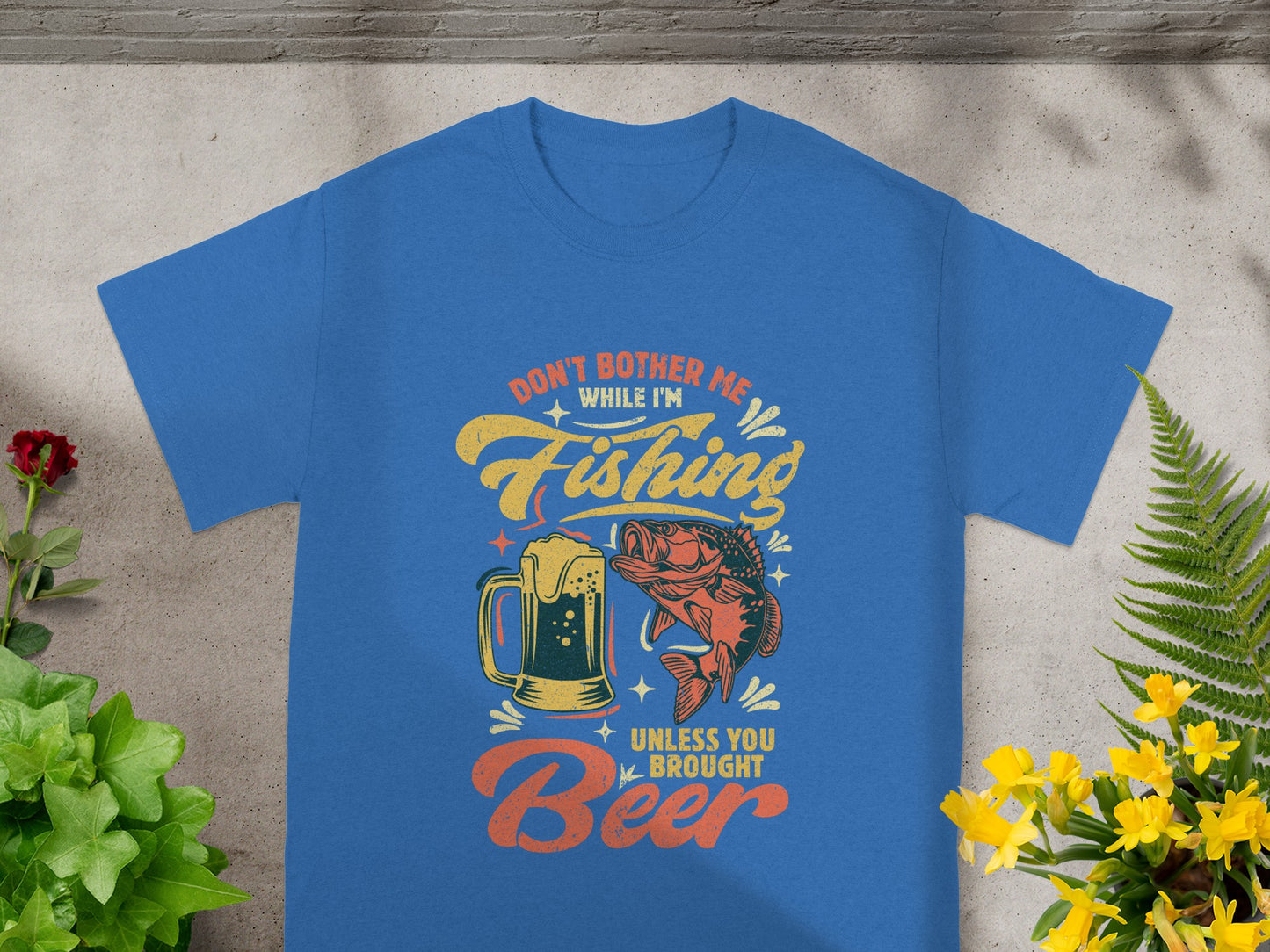 Blue t-shirt with "Don't bother me while I'm fishing unless you brought Beer" text and graphic.