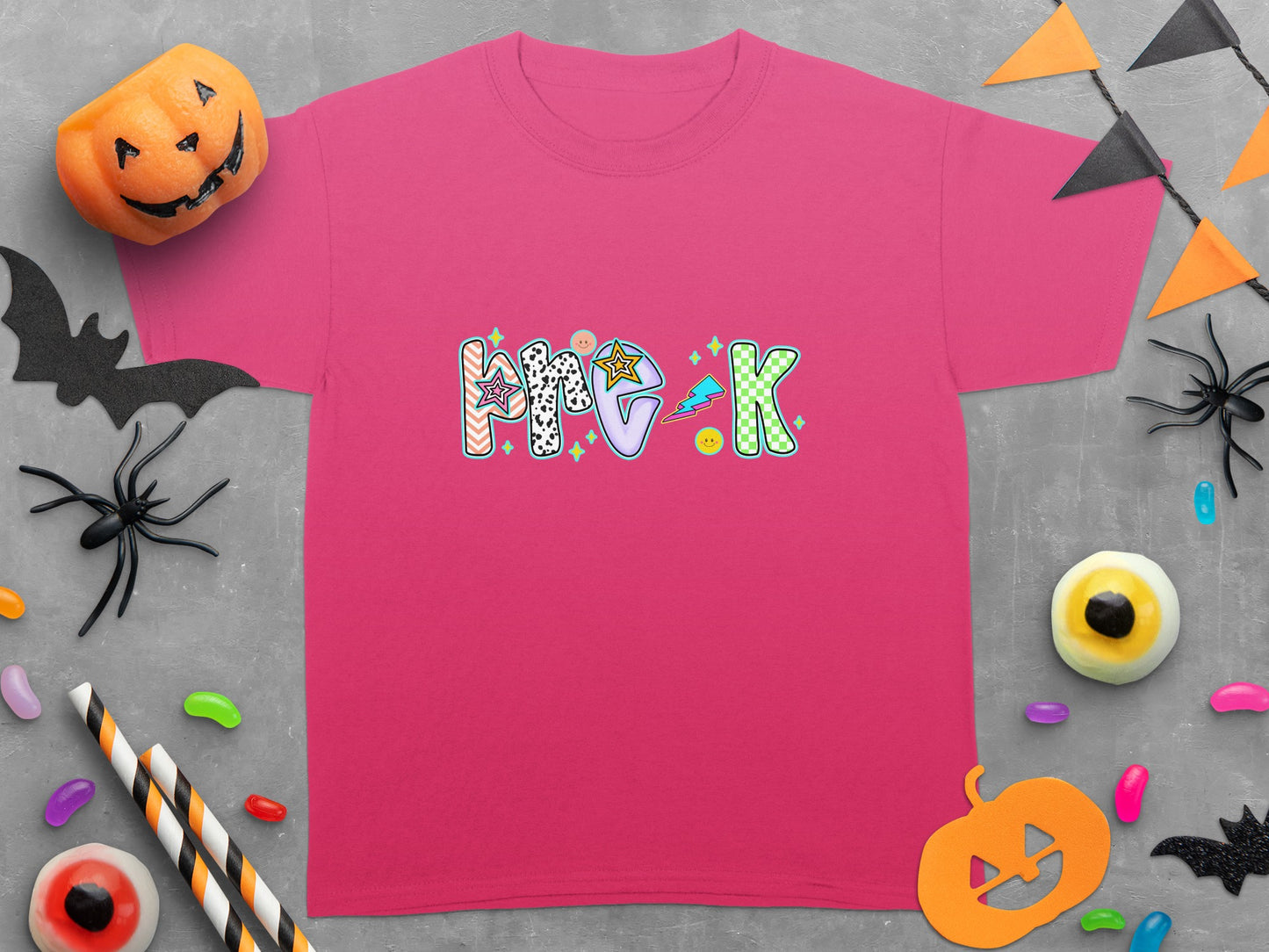Pink t-shirt with "Pre-K" in colorful, patterned block letters and Halloween decorations.