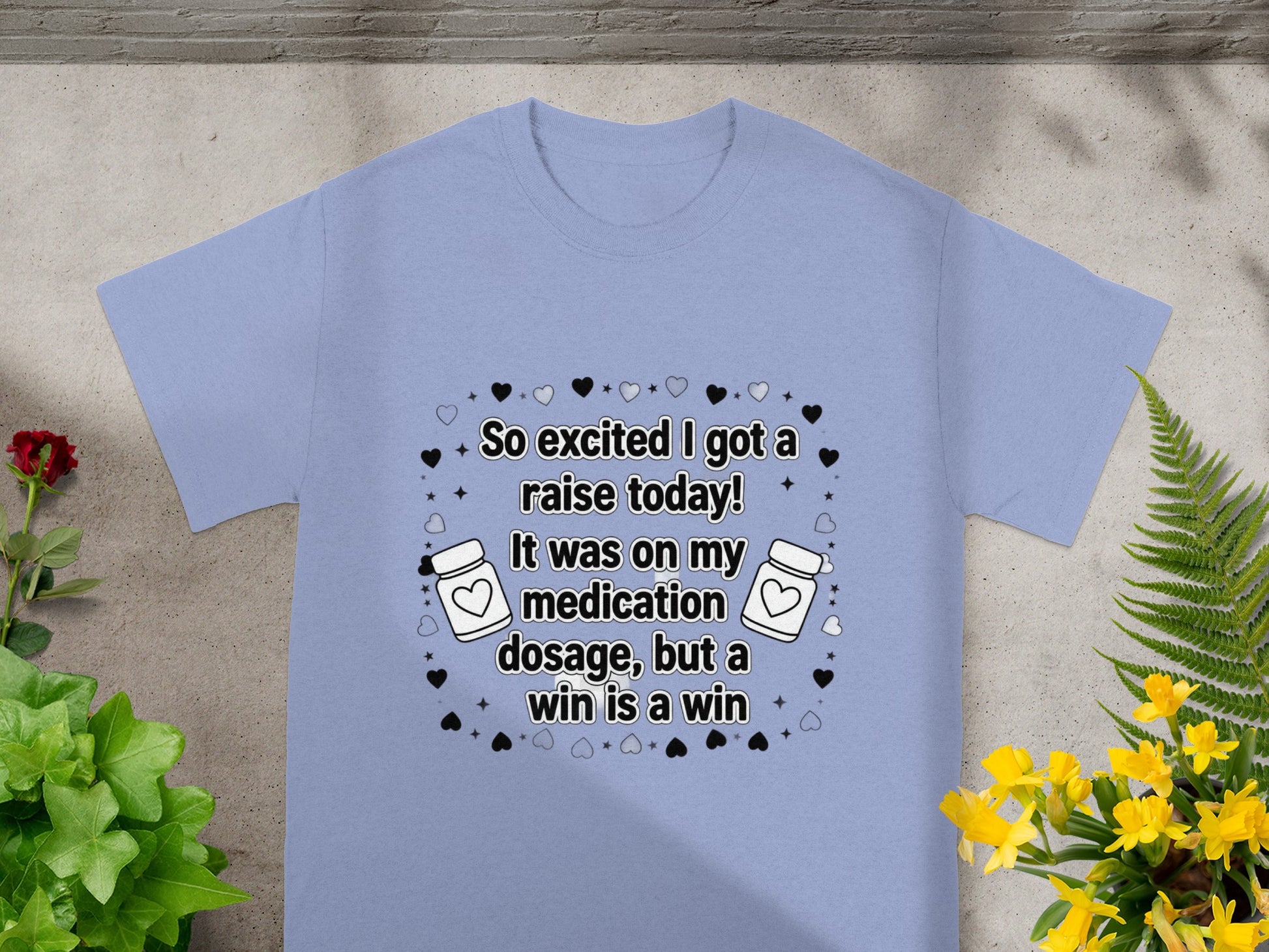 Light blue t-shirt with "So excited I got a raise today!" text design.
