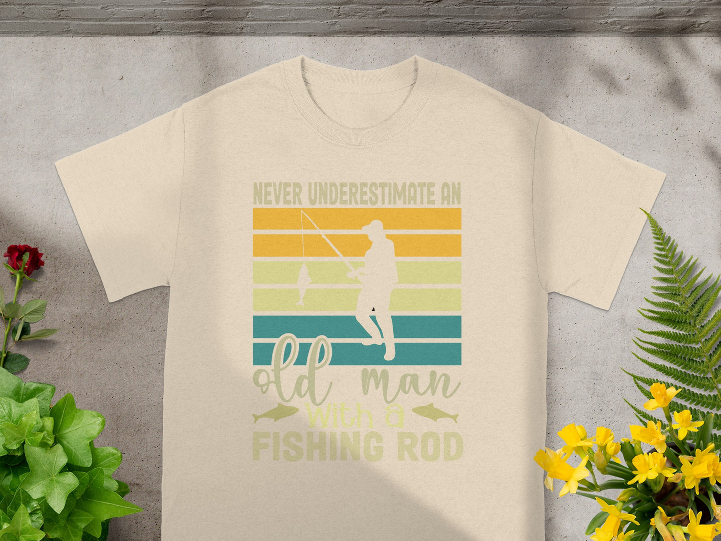T-shirt with vintage graphic: "Never underestimate an old man with a fishing rod."