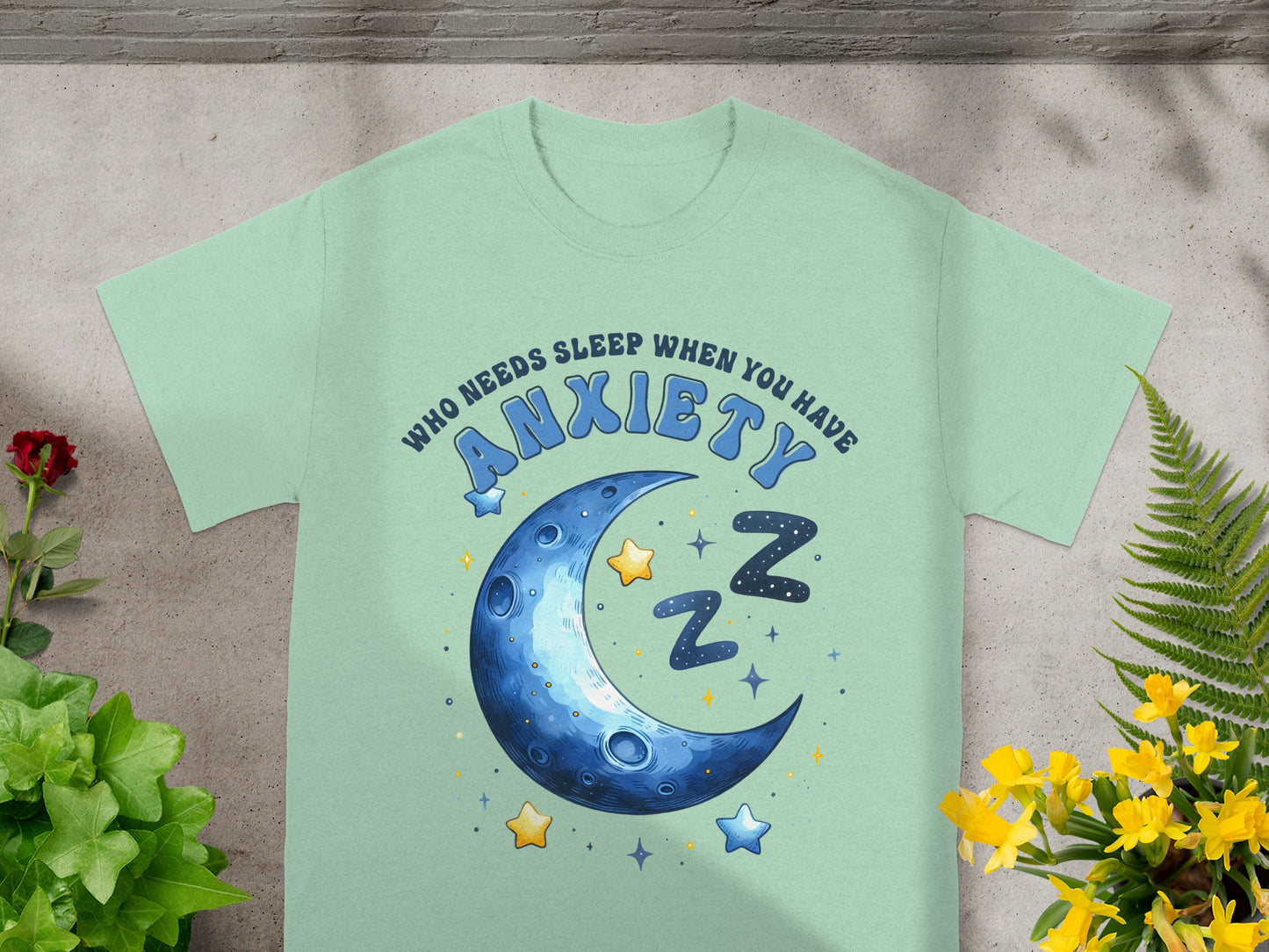 Light green t-shirt with "Who Needs Sleep When You Have Anxiety" text and moon graphic.