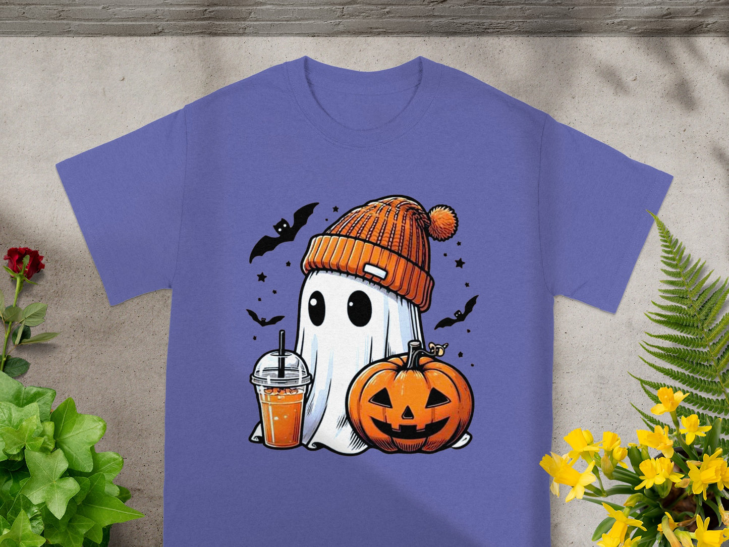 Ghost in beanie with drink and pumpkin, surrounded by bats and stars.