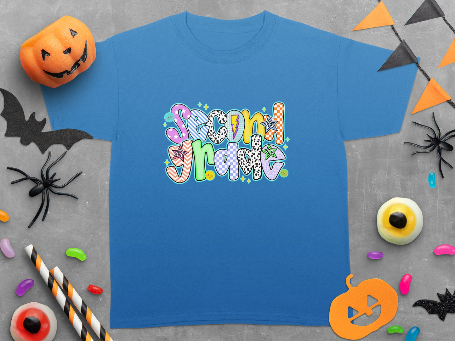 Blue t-shirt with "Second Grade" text in colorful, patterned lettering.