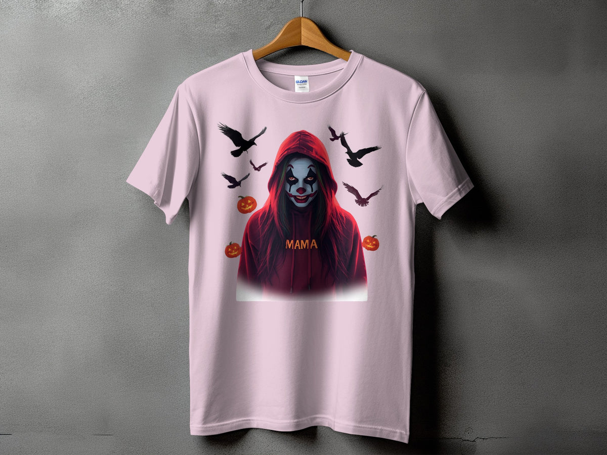 Pink t-shirt with a spooky clown design, text "MAMA", and surrounding crows and pumpkins.