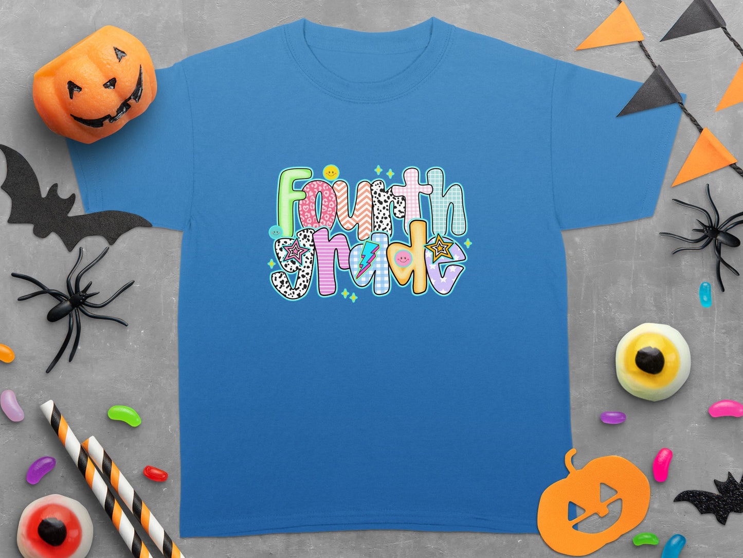 Blue t-shirt with "Fourth Grade" text featuring colorful patterned letters.