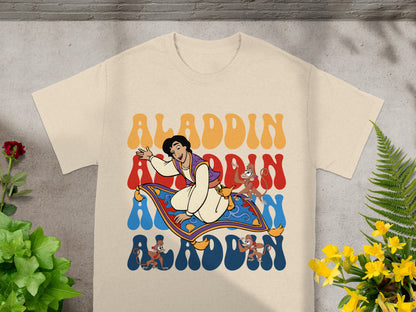 Aladdin, Abu, and magic carpet graphic on a cream t-shirt.