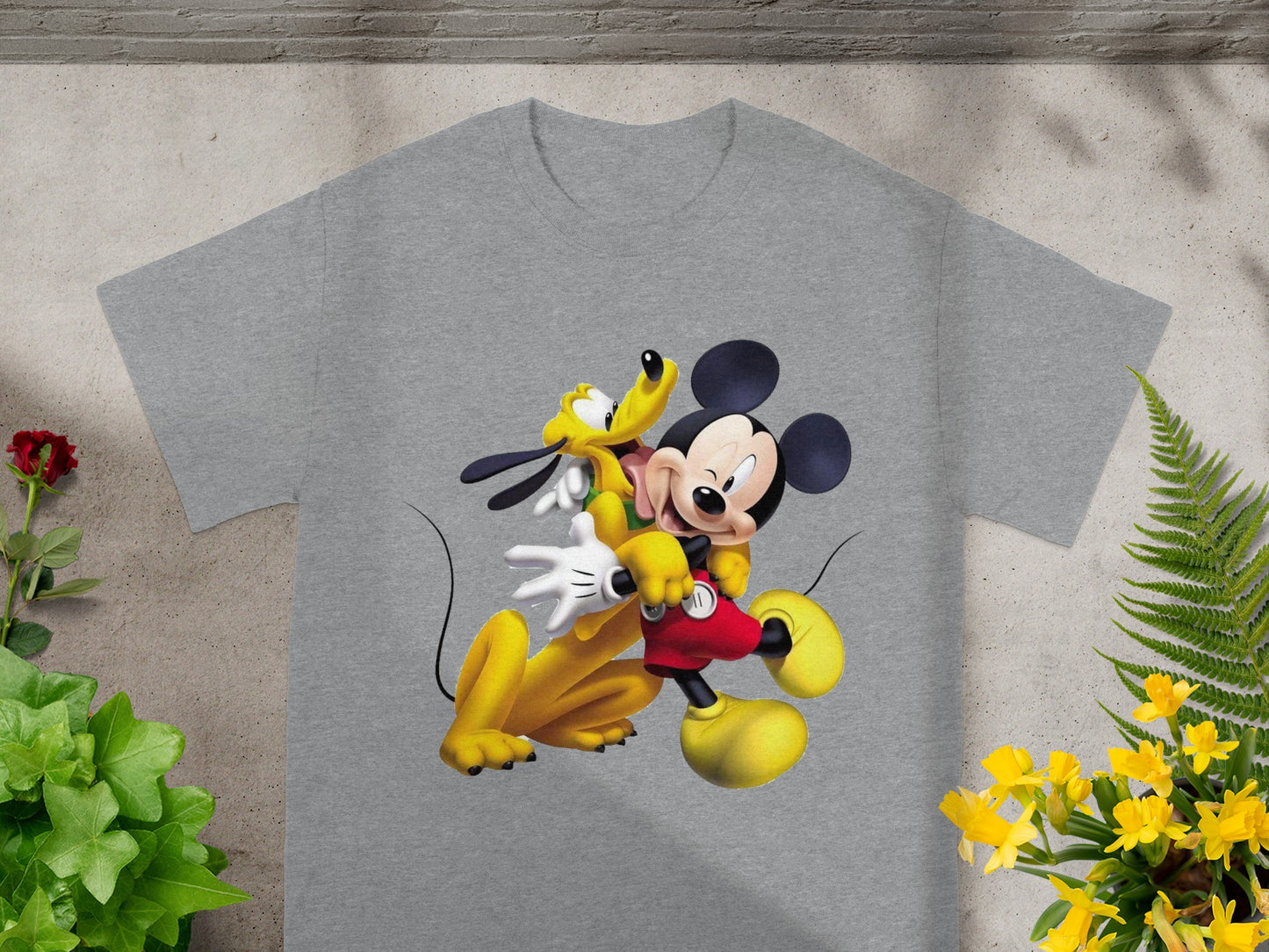 Grey t-shirt featuring Mickey Mouse and Pluto hugging.