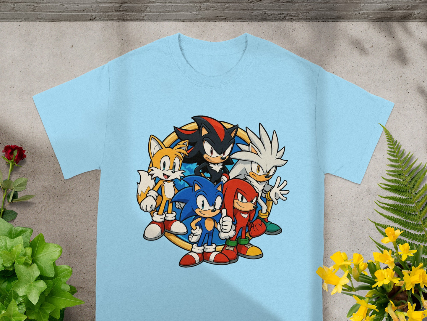 Sonic the Hedgehog and friends graphic on a light blue t-shirt.