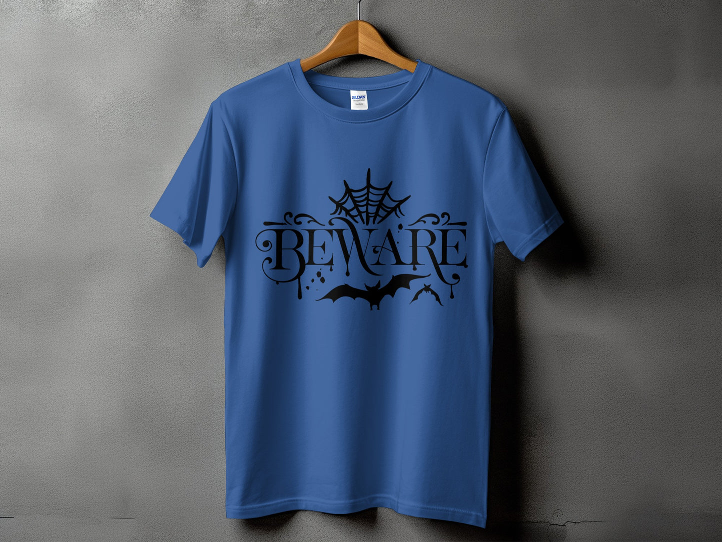 Blue t-shirt with black "BEWARE" text, spider web, and bats.